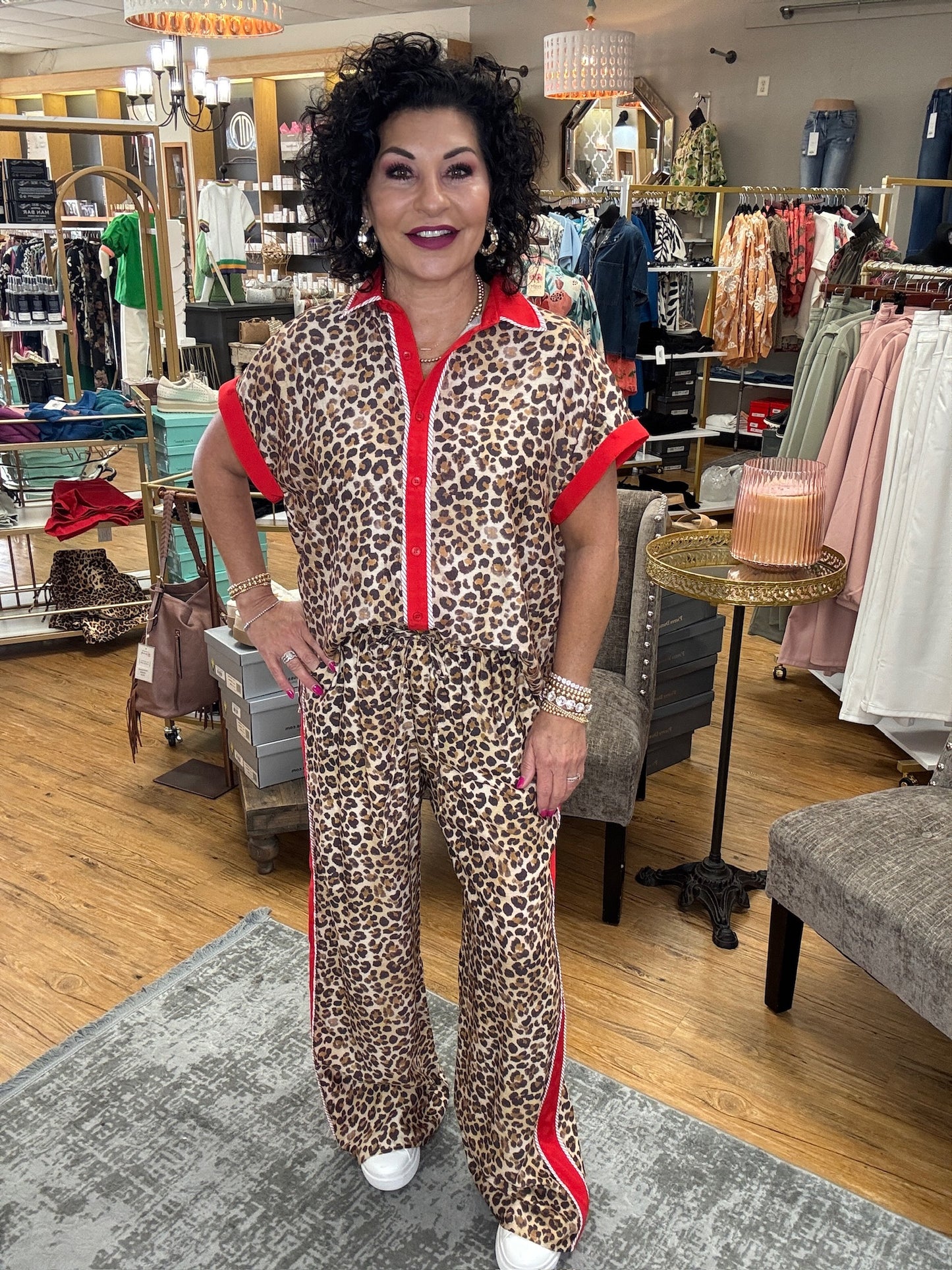 Leopard print high waisted wide leg pants. Side contrast featuring accented binding detail. Adjustable tie elastic waistband. Side pockets