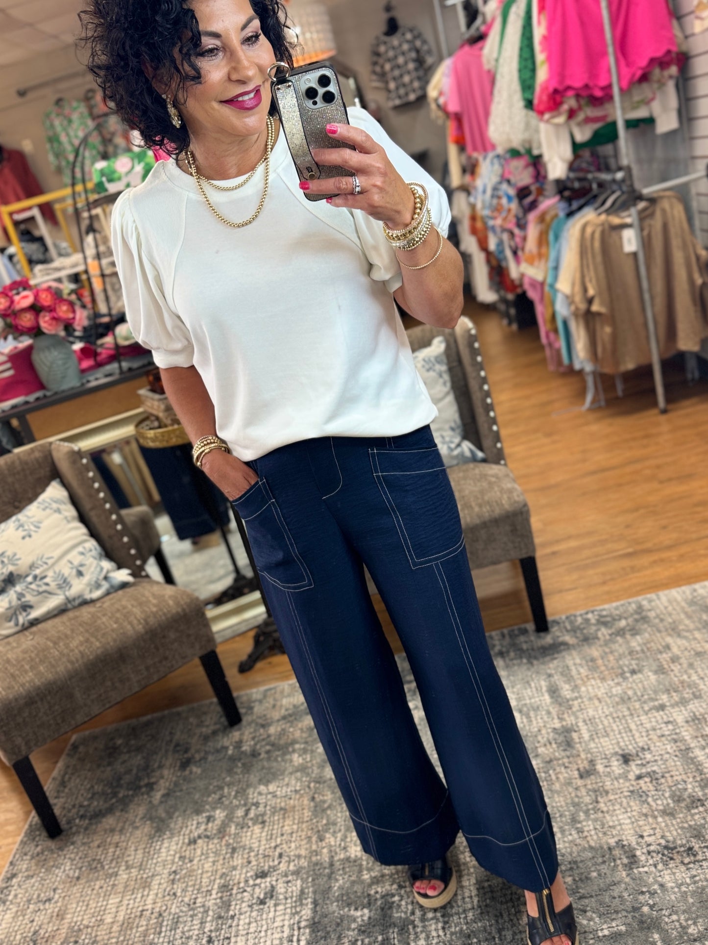 Machine wash wide legs pants with drawstring waistline, front slant pockets, back patch pockets, and contrast stitching edge.