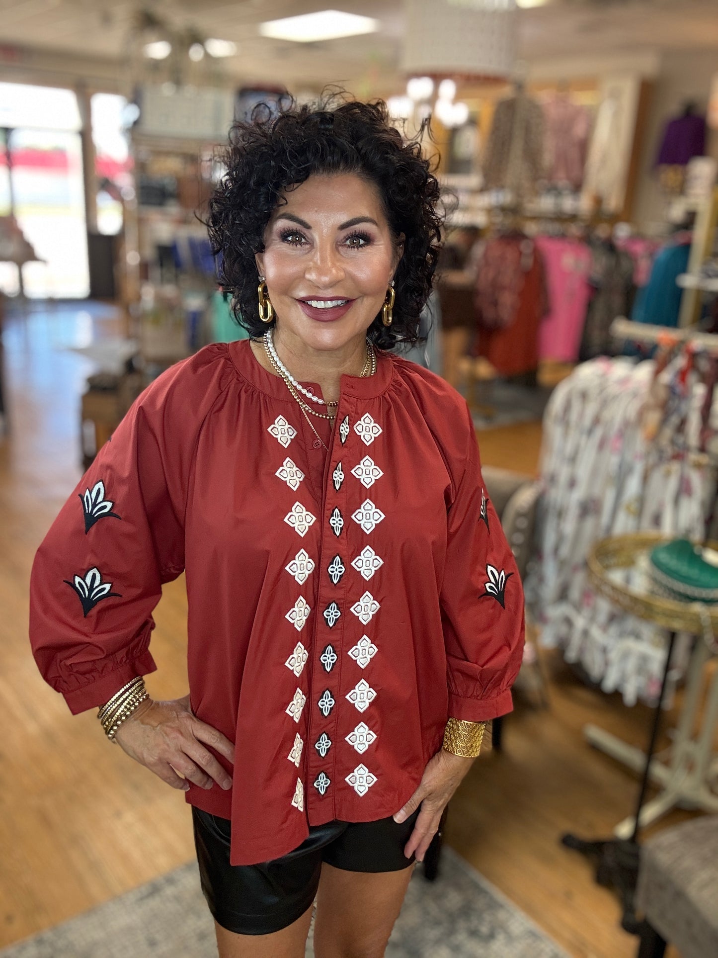 Embroidered 3/4 sleeve top featuring split neckline