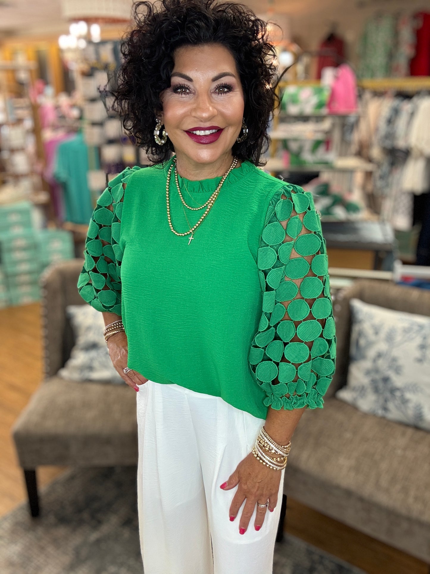 Solid top with frilled neck, back key hole, three quarter sleeves finished with dot textured lace fabric and frilled hems