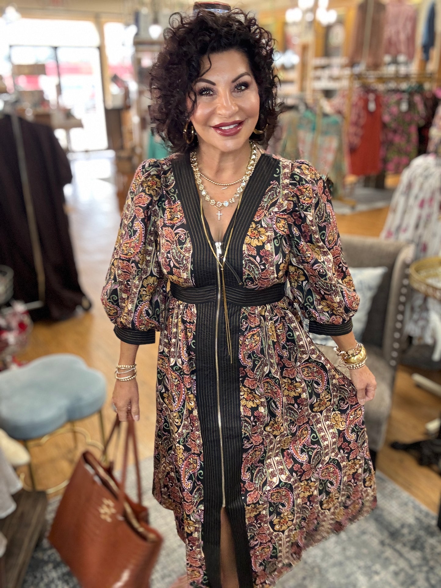Paisley print puff sleeve midi dress featuring striped trim and partial front zipper closure
