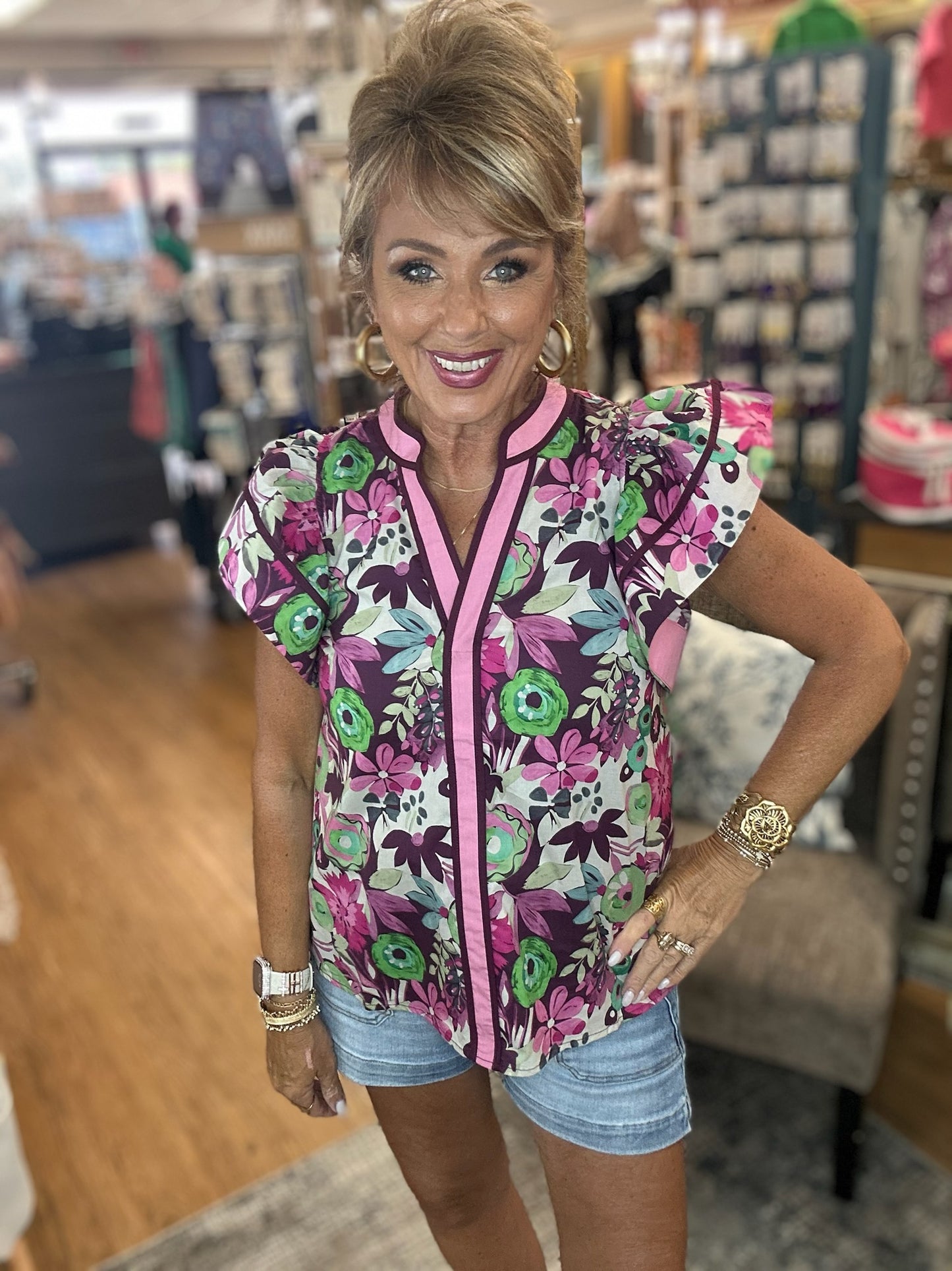 Multi-floral print flutter ruffle sleeve featuring contrast accent V-neck