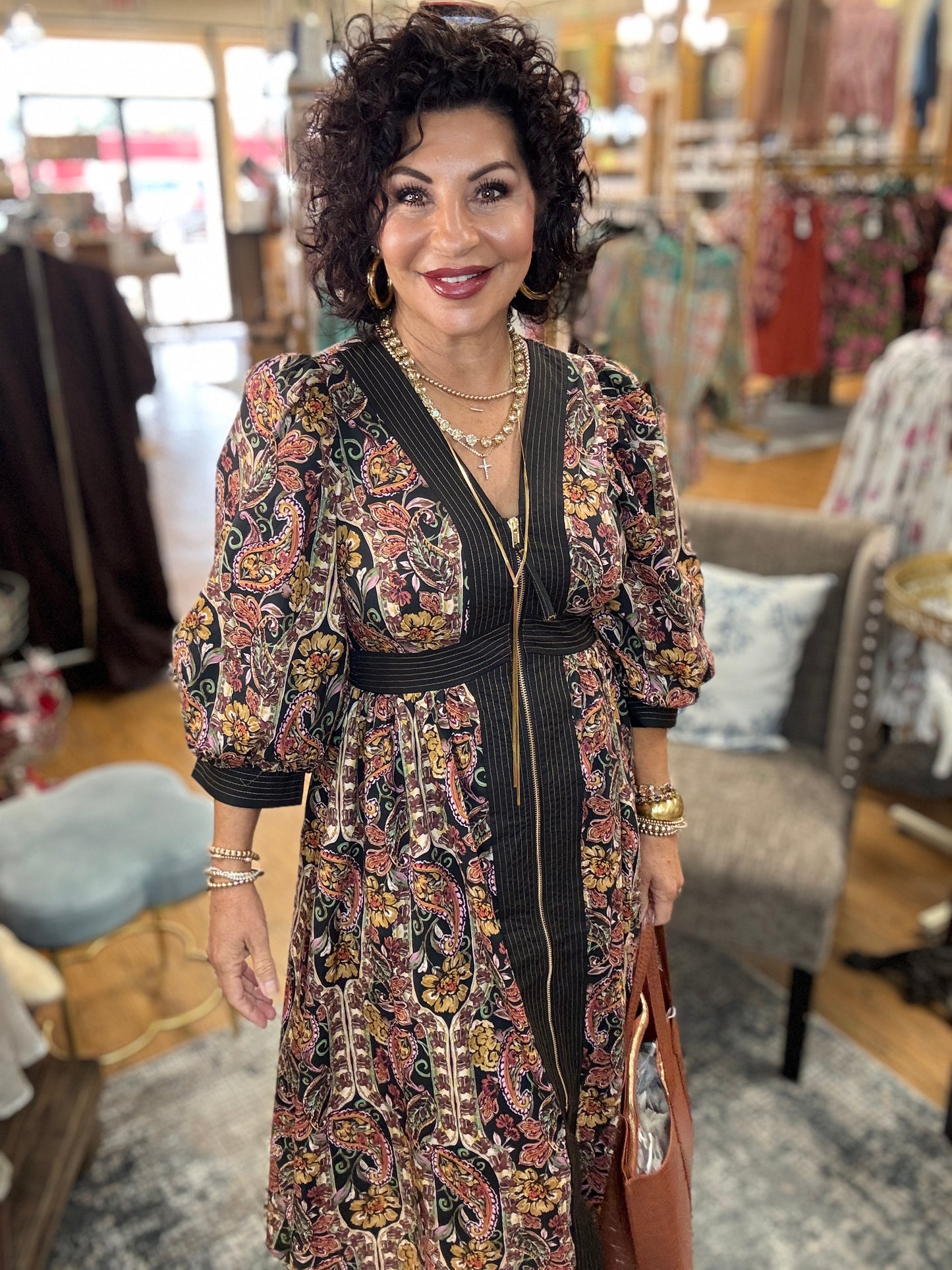 Paisley print puff sleeve midi dress featuring striped trim and partial front zipper closure