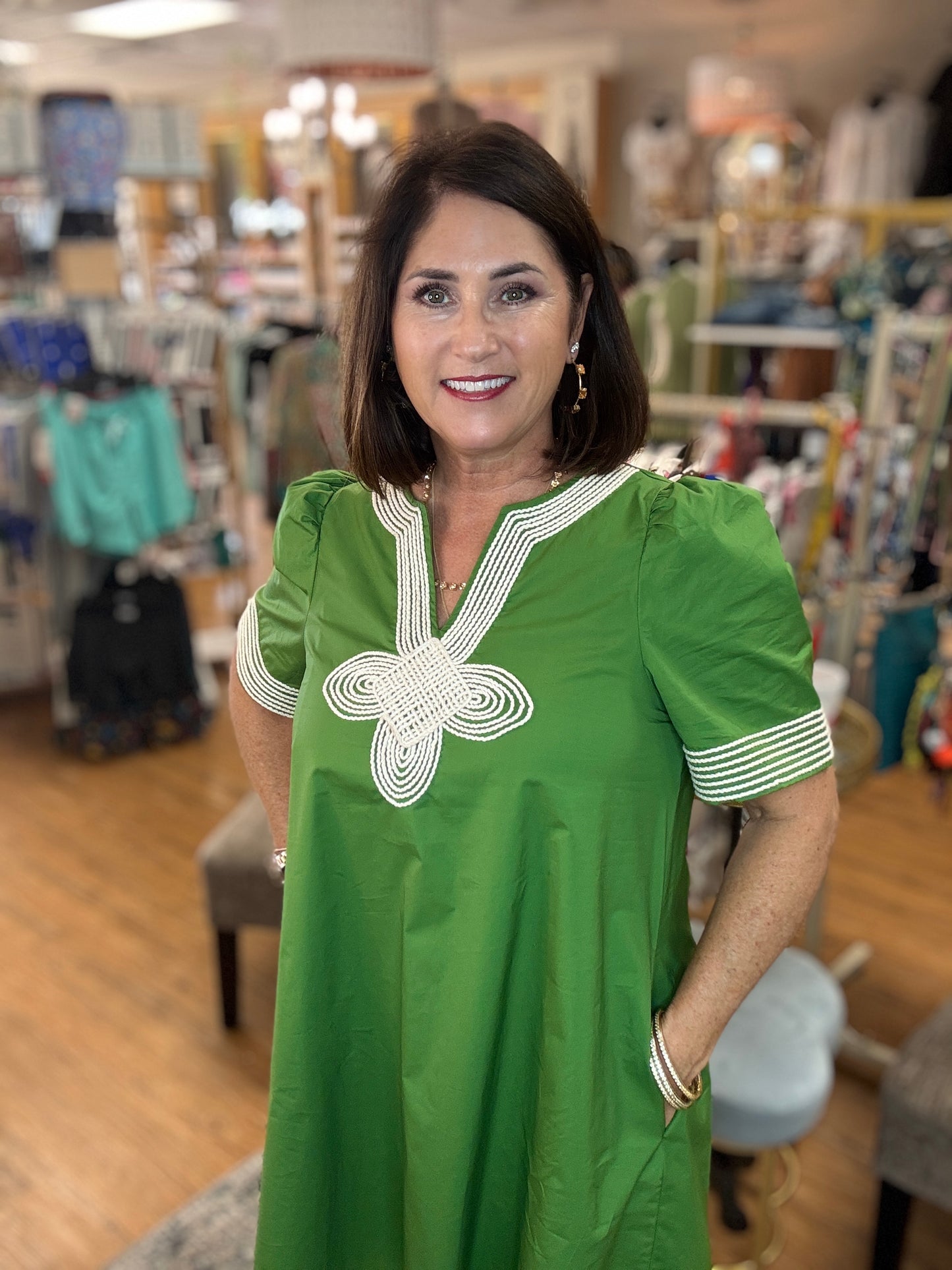 Solid short puff sleeve mini dress featuring embroidered trim V-neck