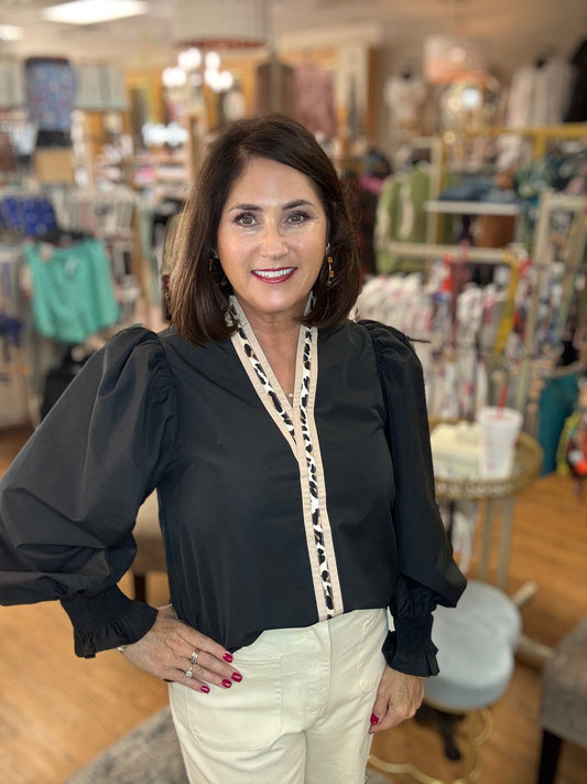 Solid long sleeve top featuring animal printed contrast at front placket