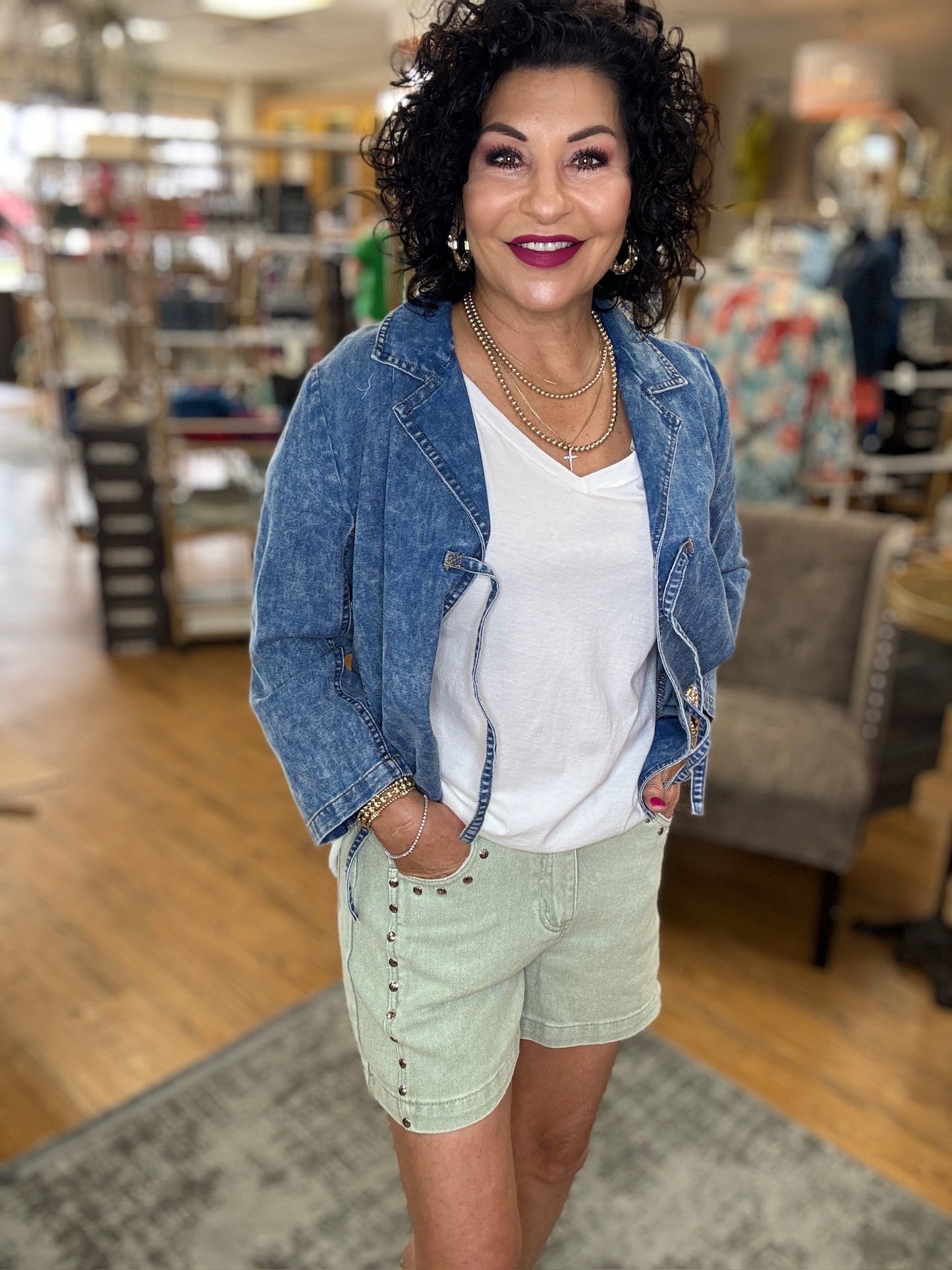 Denim high waist classic denim front button zipper closure featuring accented metallic studded shorts. Classic denim pockets front and back