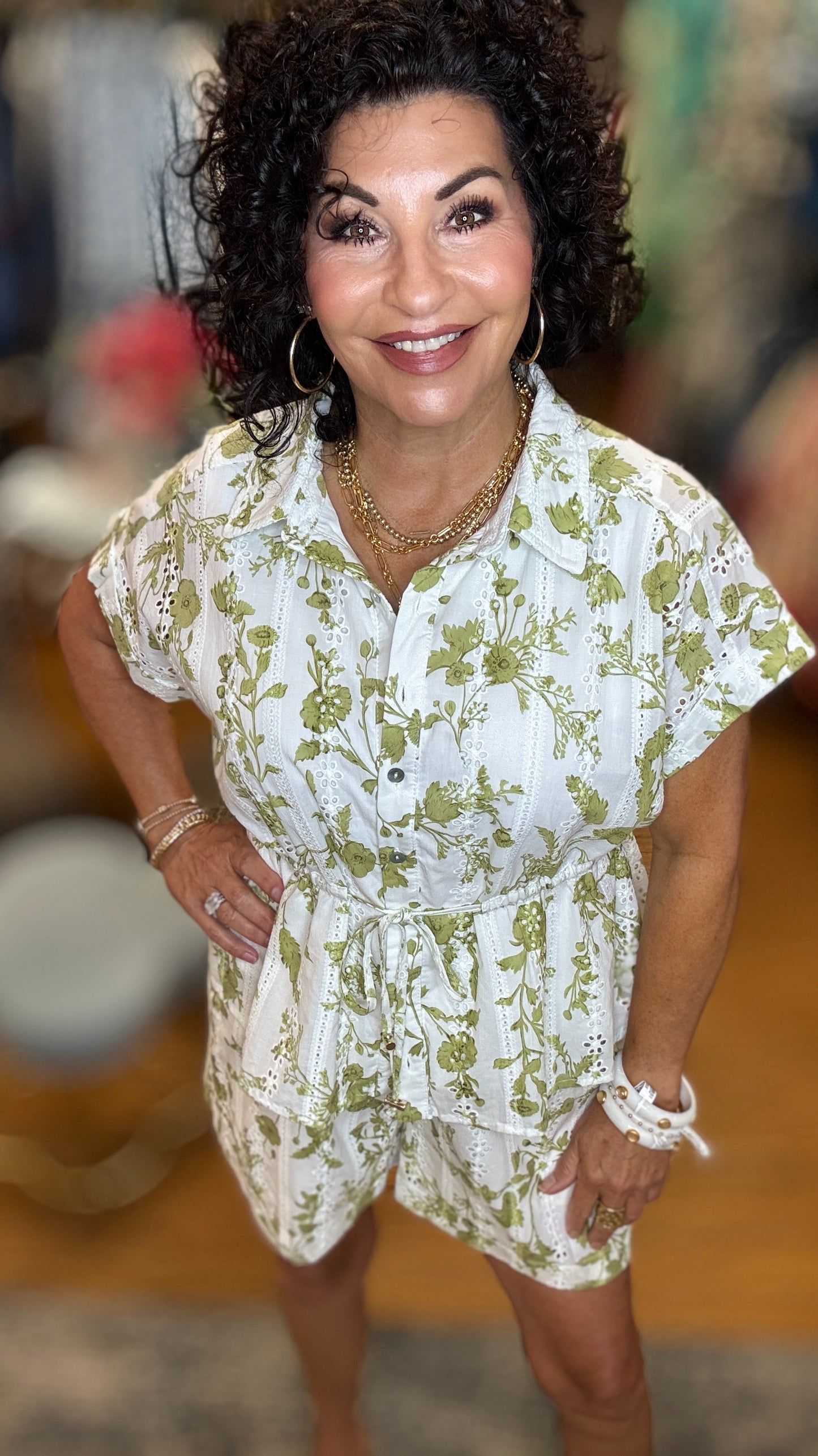 Floral print short sleeve top featuring collar and button closure