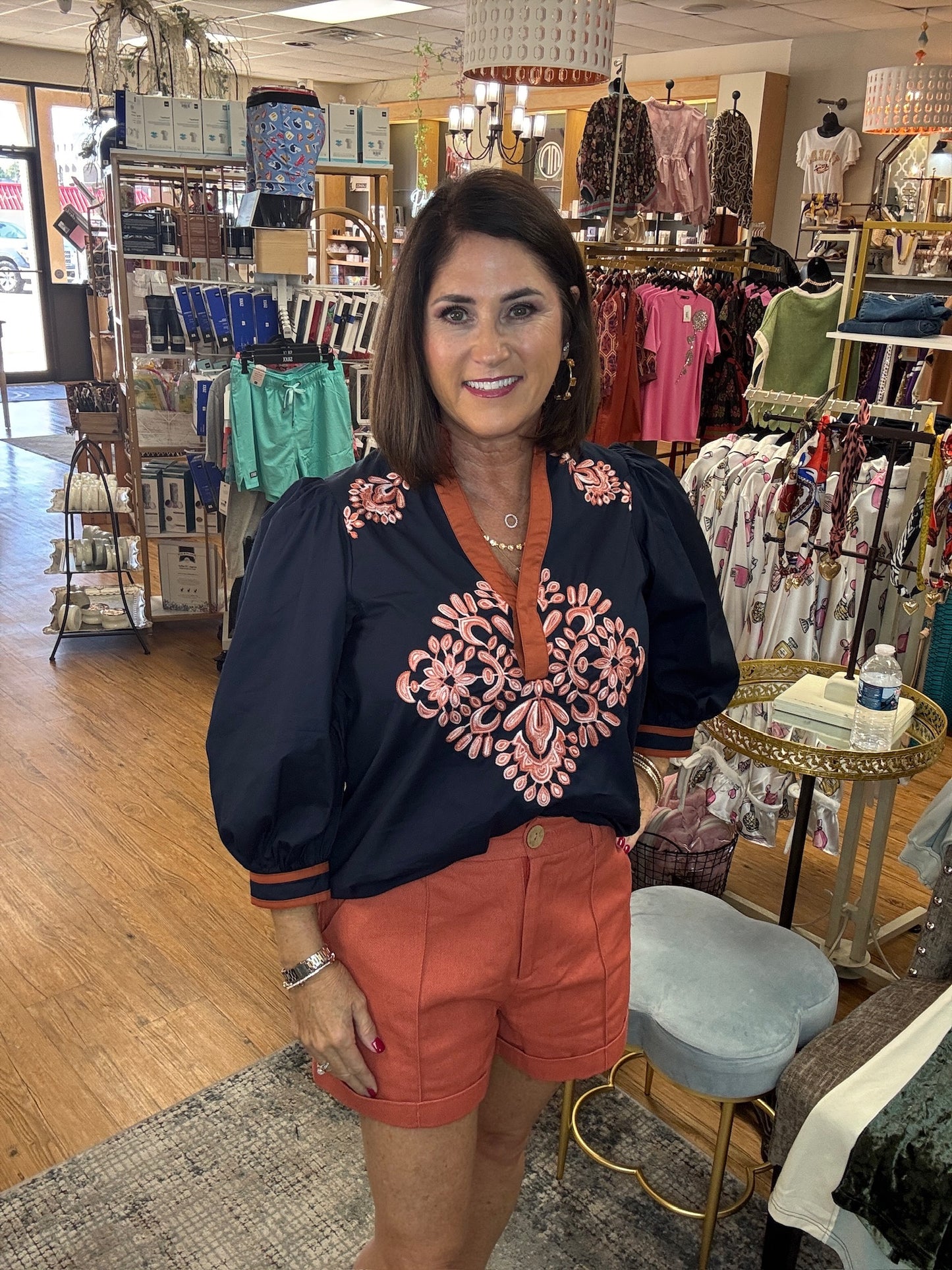 Solid 3/4 puff sleeve top featuring contrast trim split V-neck with ruffled stand collar
