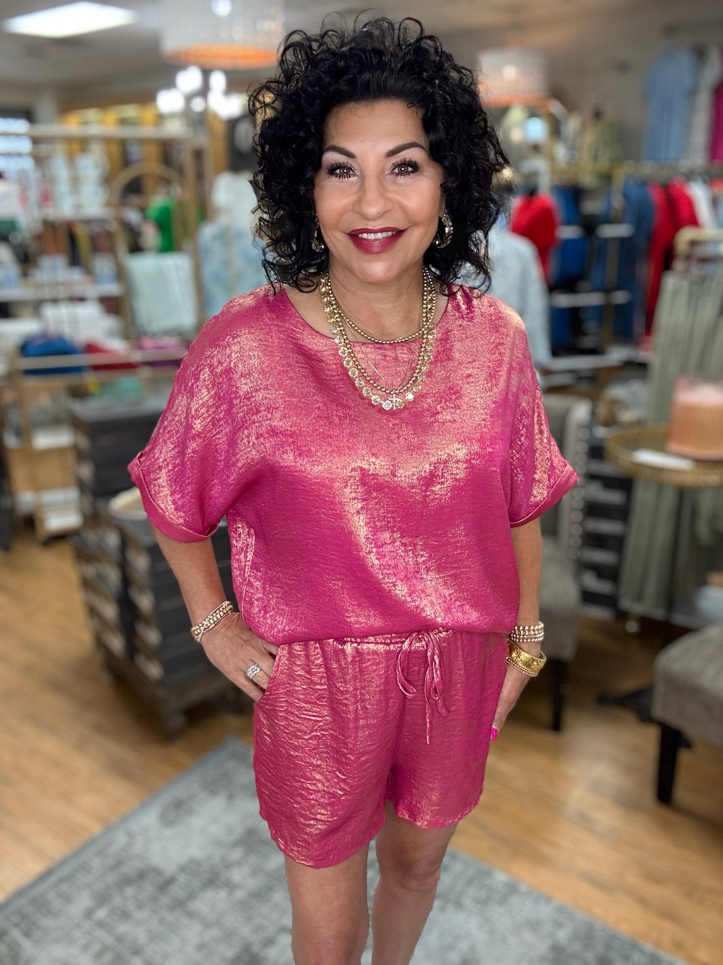 Metallic loungewear sets Top with U-neck, back inverted pleats, short dolman sleeves, and band cuffs. Bottoms are drawstring shorts with side pockets