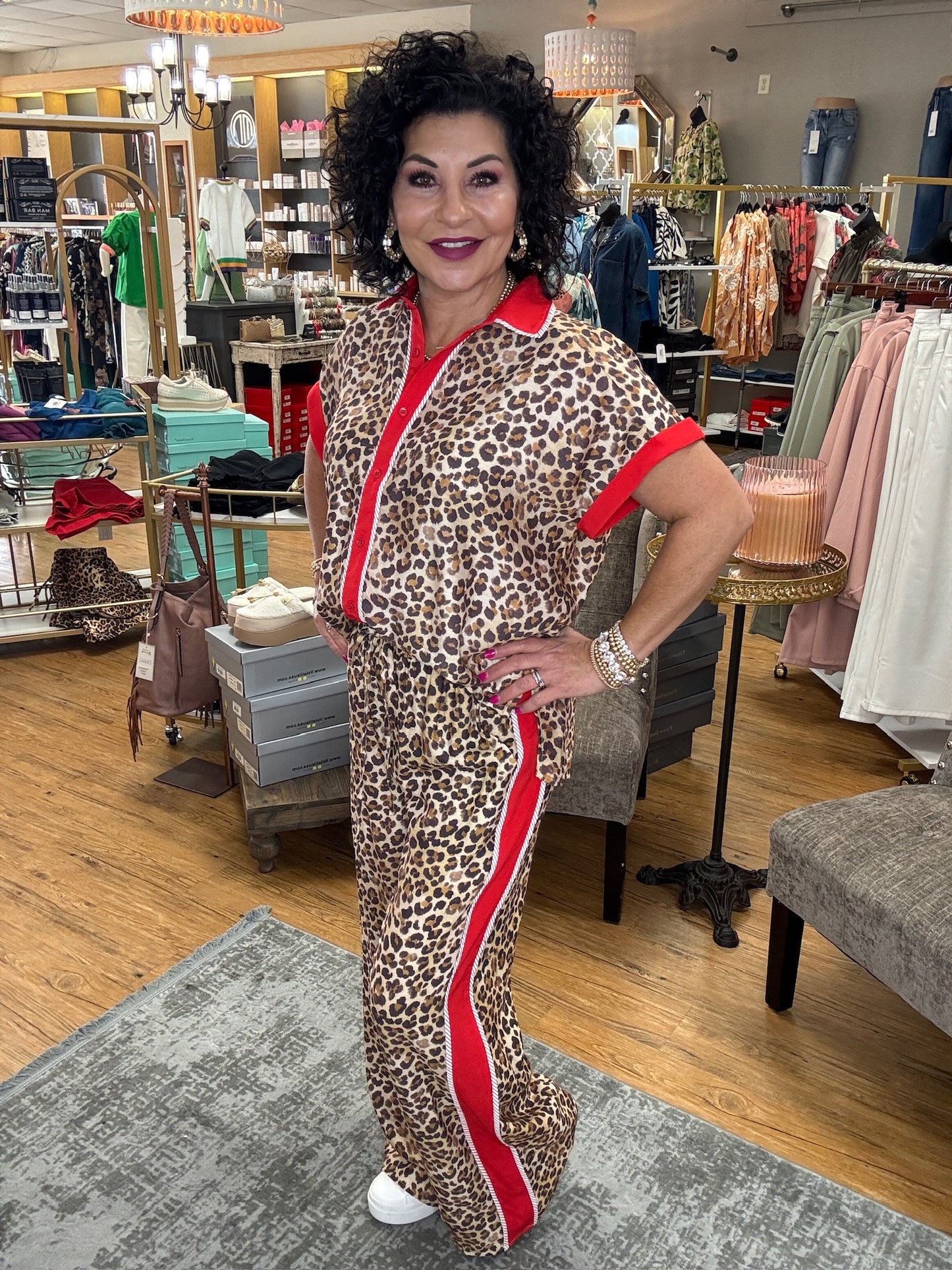 Leopard print high waisted wide leg pants. Side contrast featuring accented binding detail. Adjustable tie elastic waistband. Side pockets