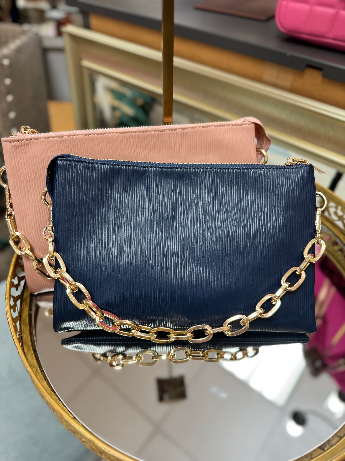 Textured clutch with oval chain strap
