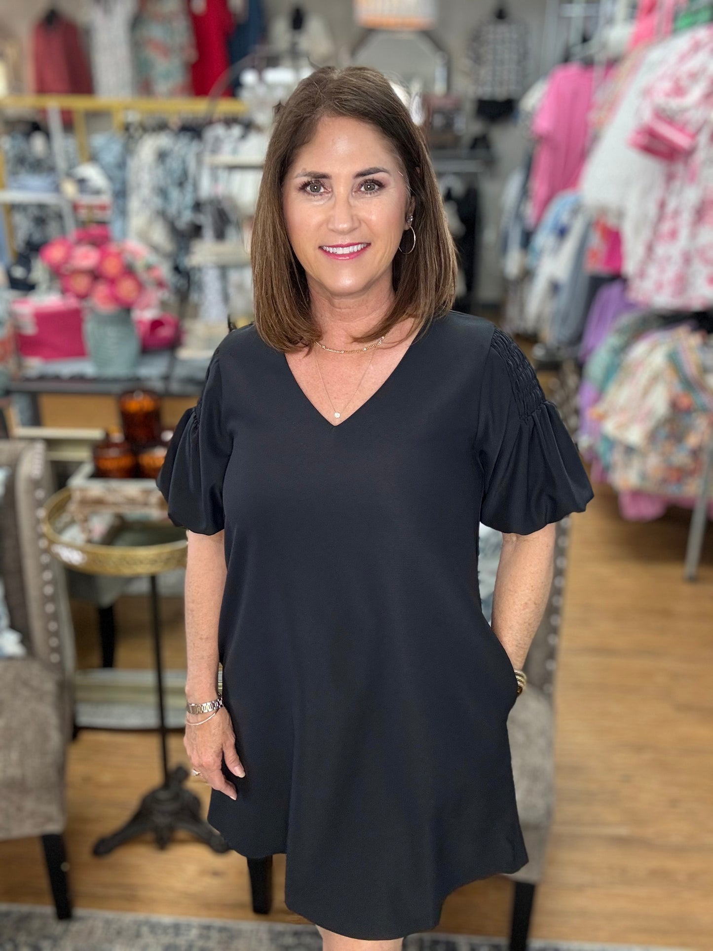 Short puff sleeves solid shift dress, smocking shoulder accent, side pockets.