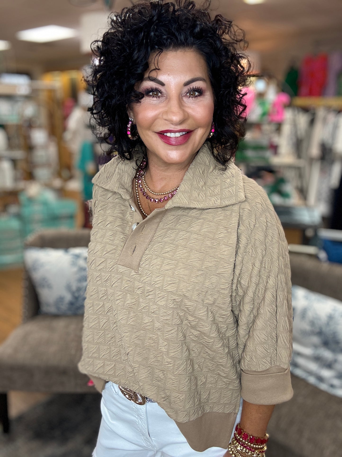 Textured pullover top with buttoned henley collared neck, three quarter kimono sleeves,