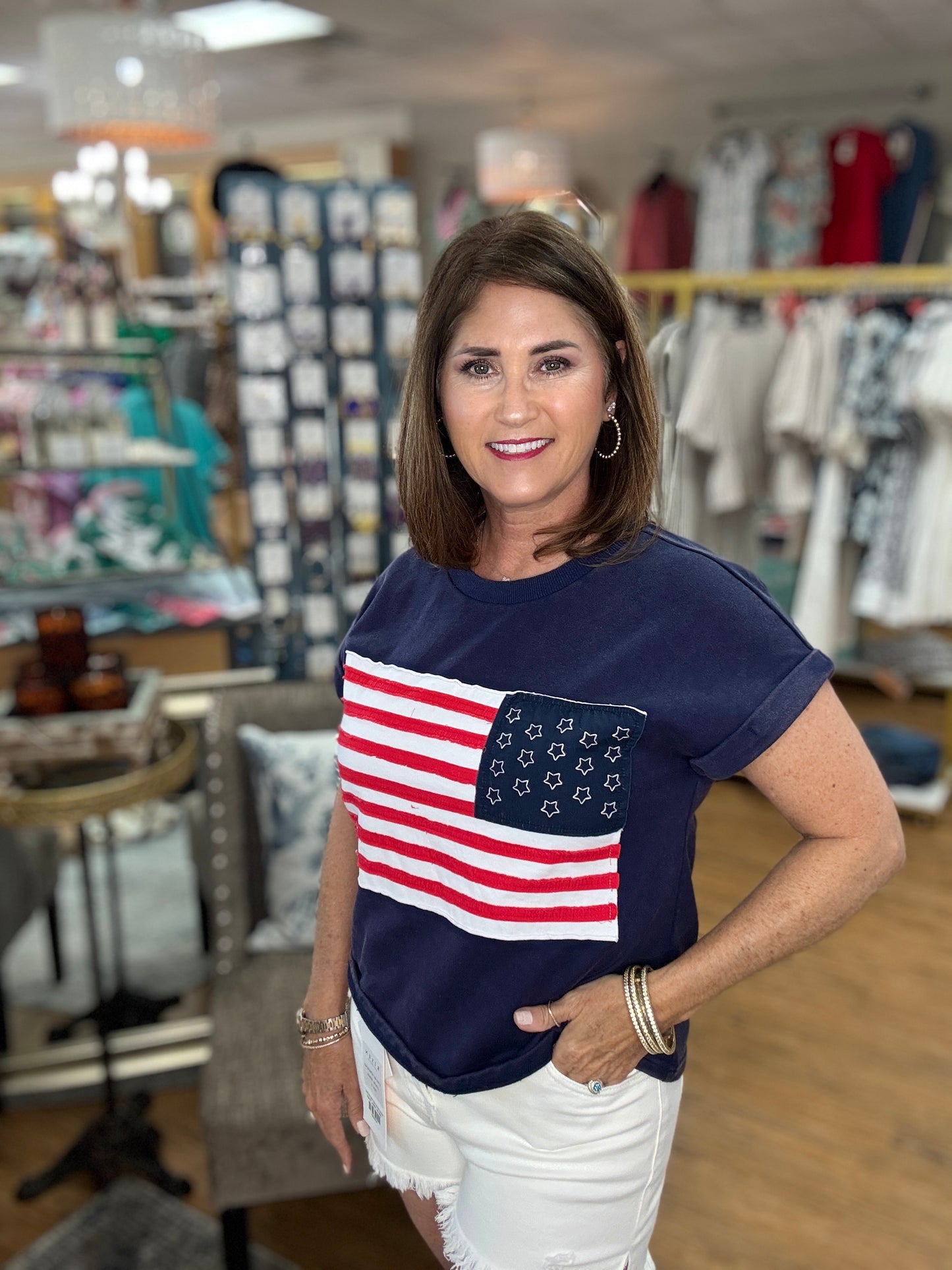 American flag patch top with U-neck, and cuffed short sleeves.