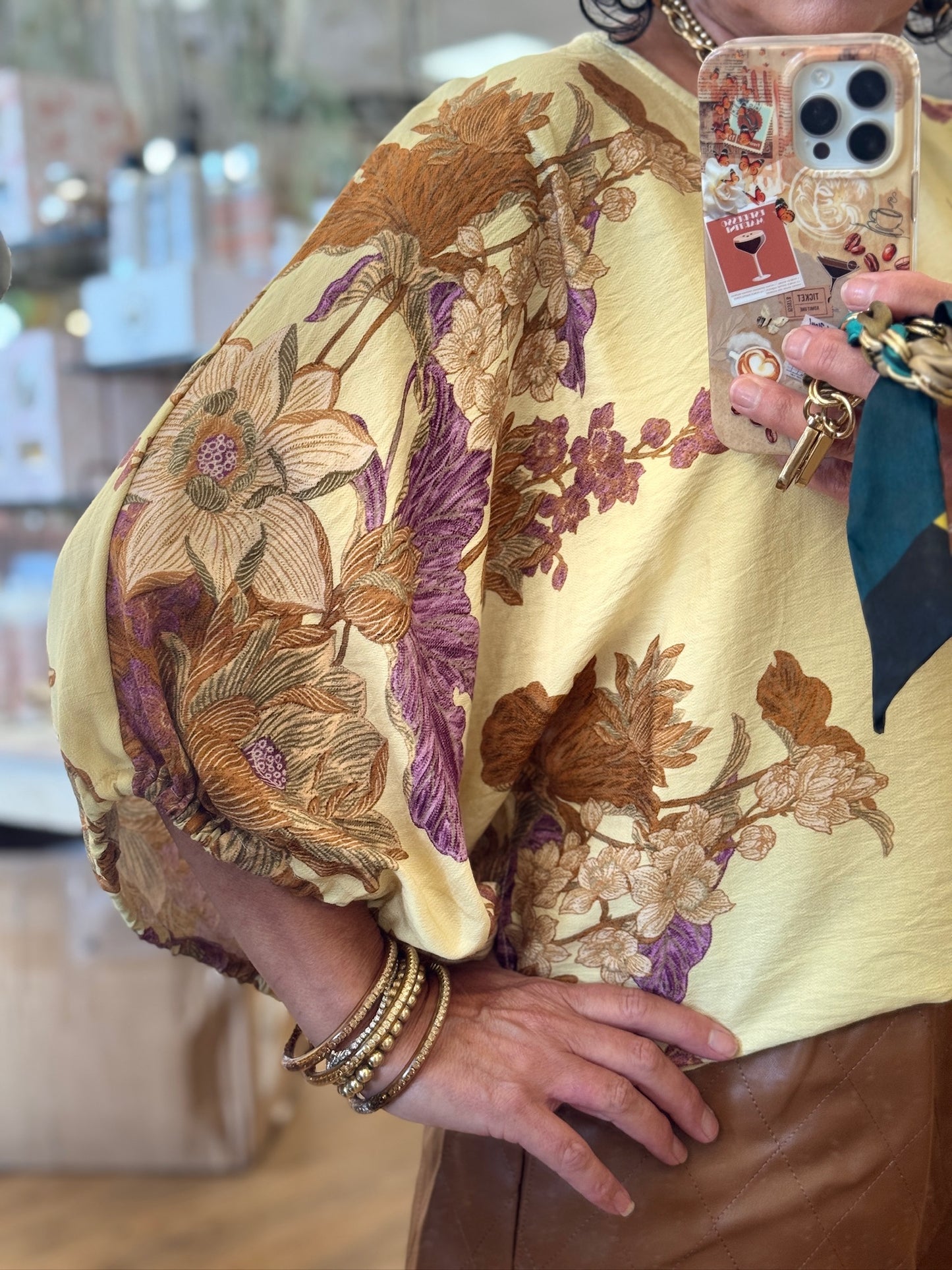 Botanical print ¾ sleeve puff top featuring textured fabric