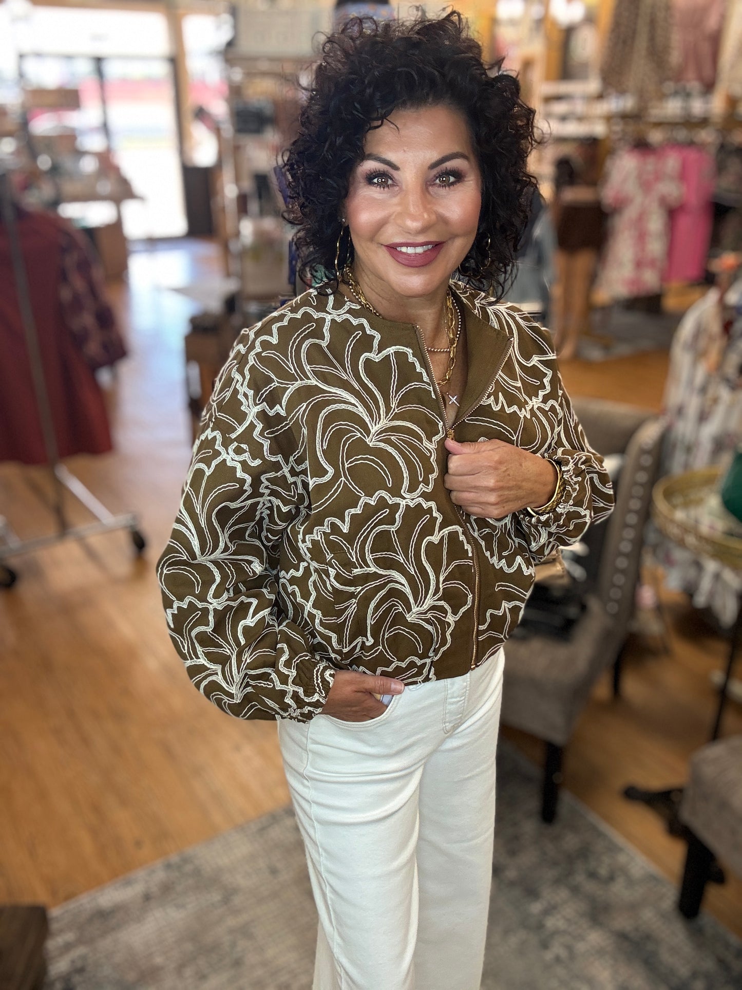 Textured long sleeve zip-up cropped jacket featuring floral embroidery
