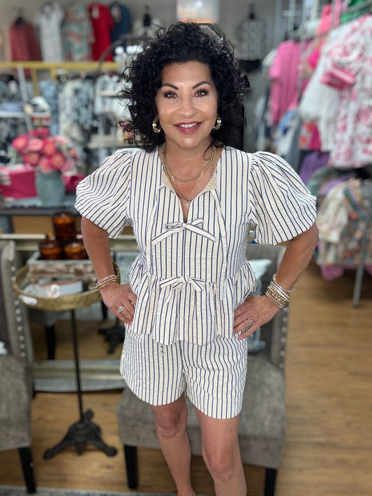 Striped high waisted pull on shorts. Elastic waistband. Pockets at side