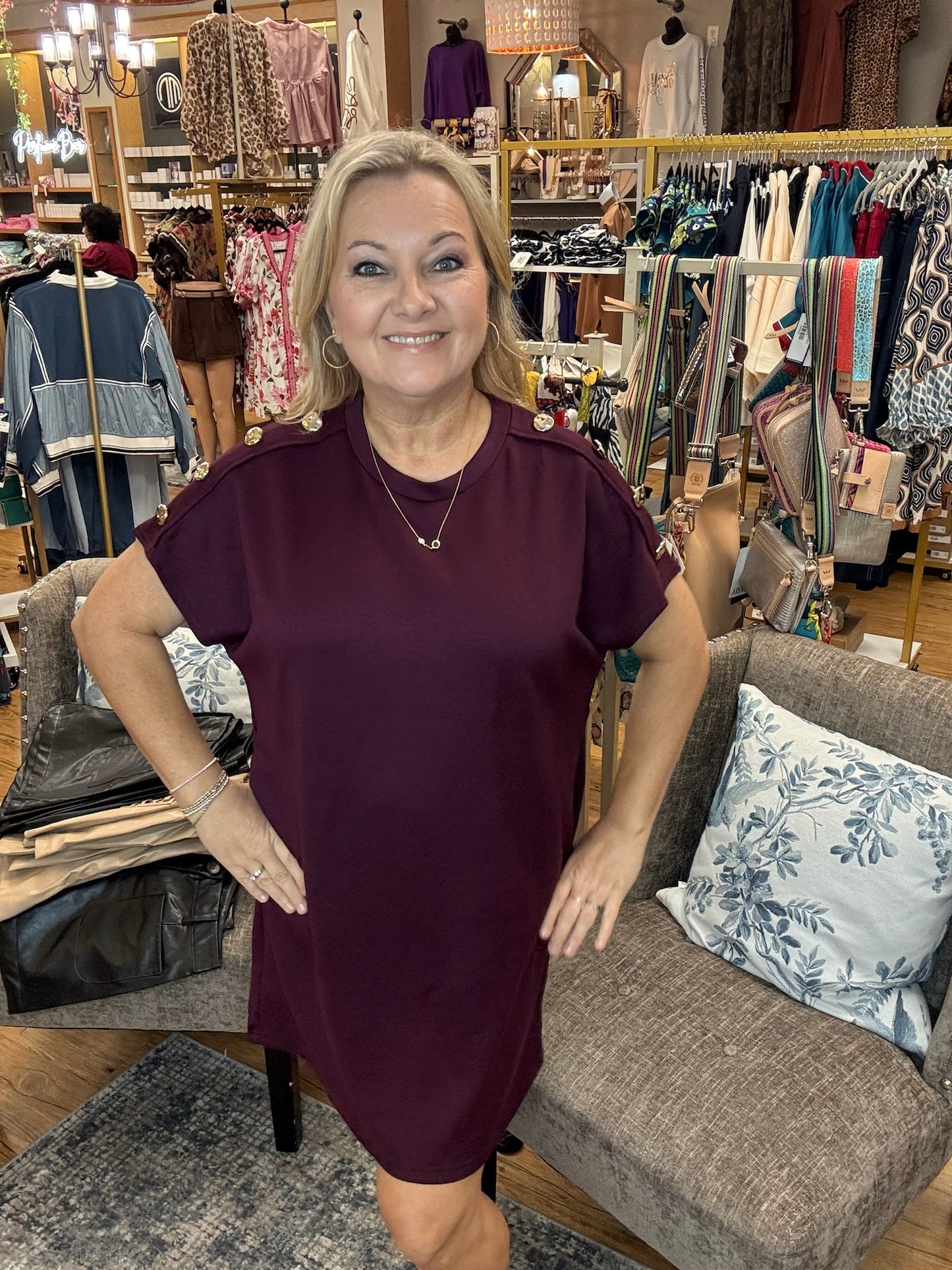 Solid short sleeve mini dress featuring decorative gold button
