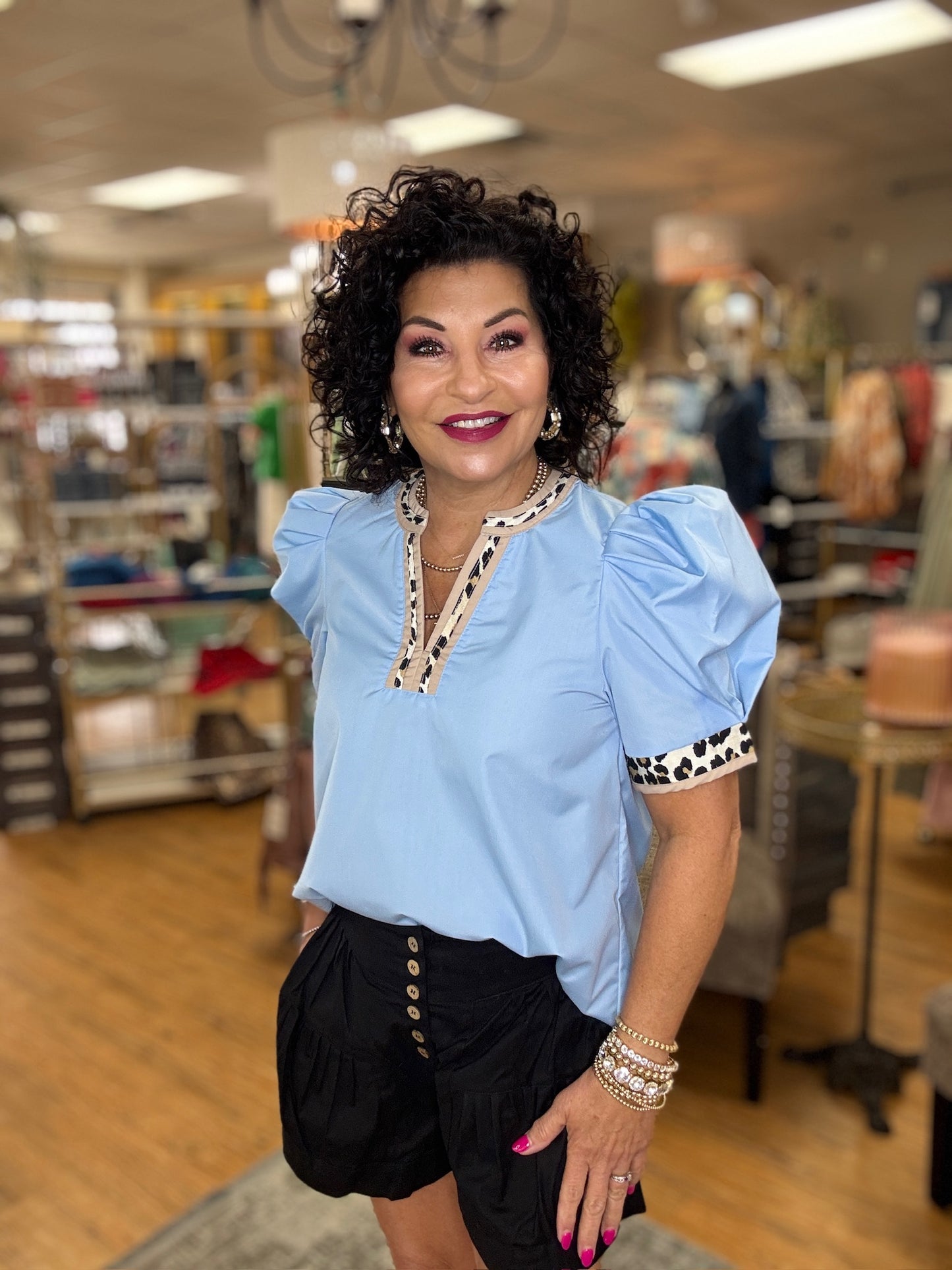 Blue top with animal print trim