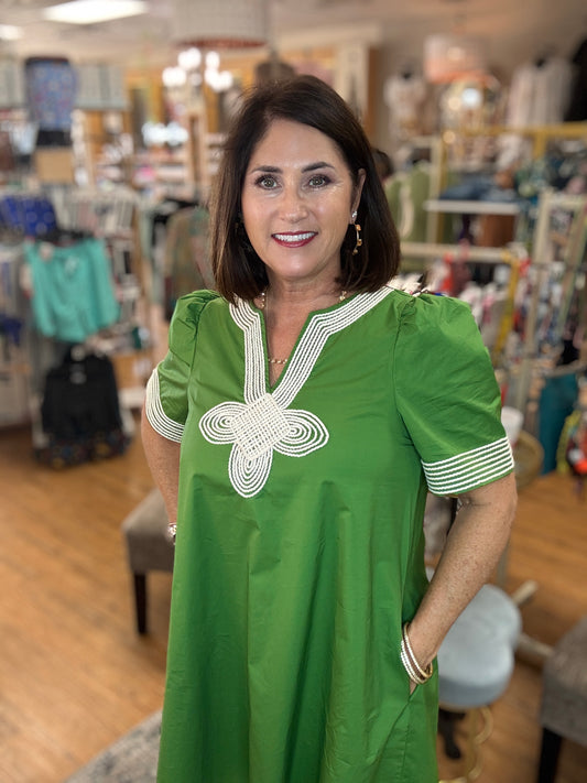 Solid short puff sleeve mini dress featuring embroidered trim V-neck