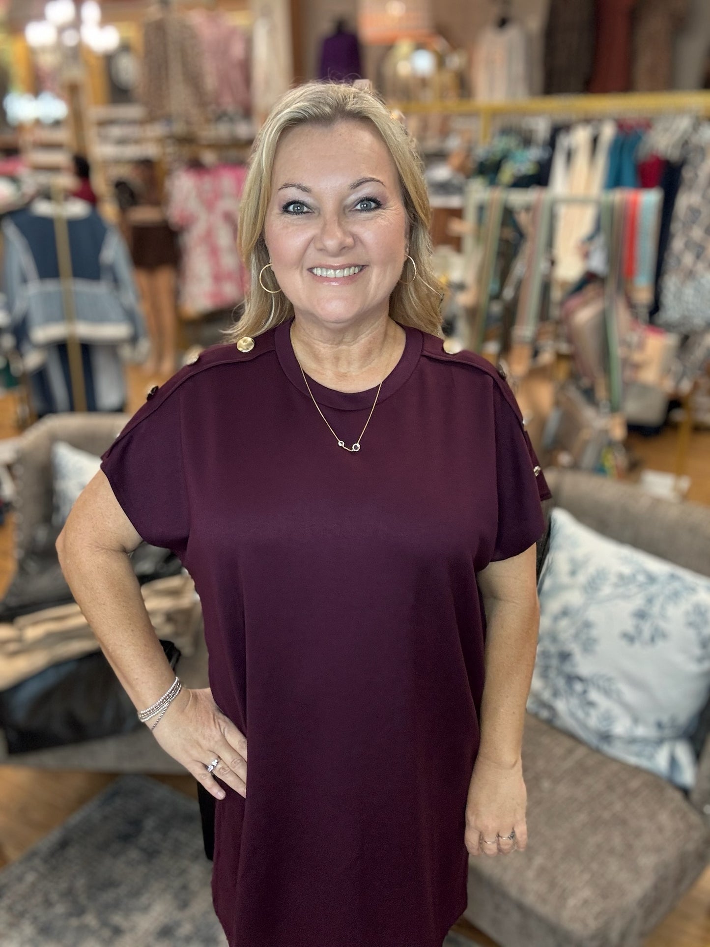 Solid short sleeve mini dress featuring decorative gold button