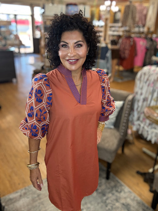 Solid 3/4 sleeve mini dress featuring textured jacquard sleeve