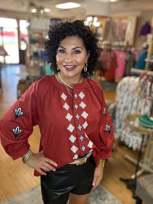 Embroidered 3/4 sleeve top featuring split neckline