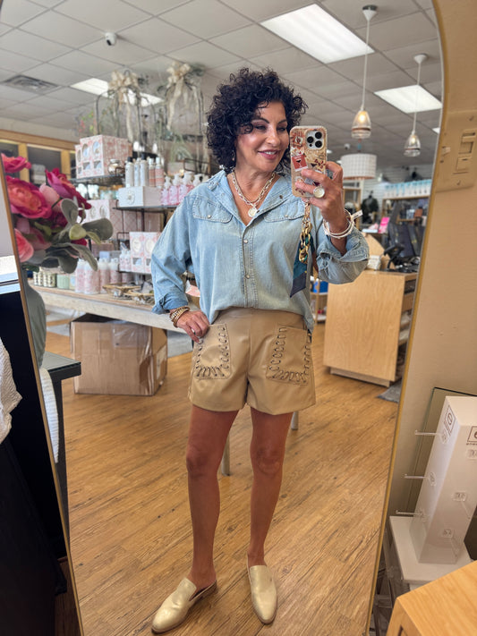 Solid high-waist shorts featuring grommet lace-up detail