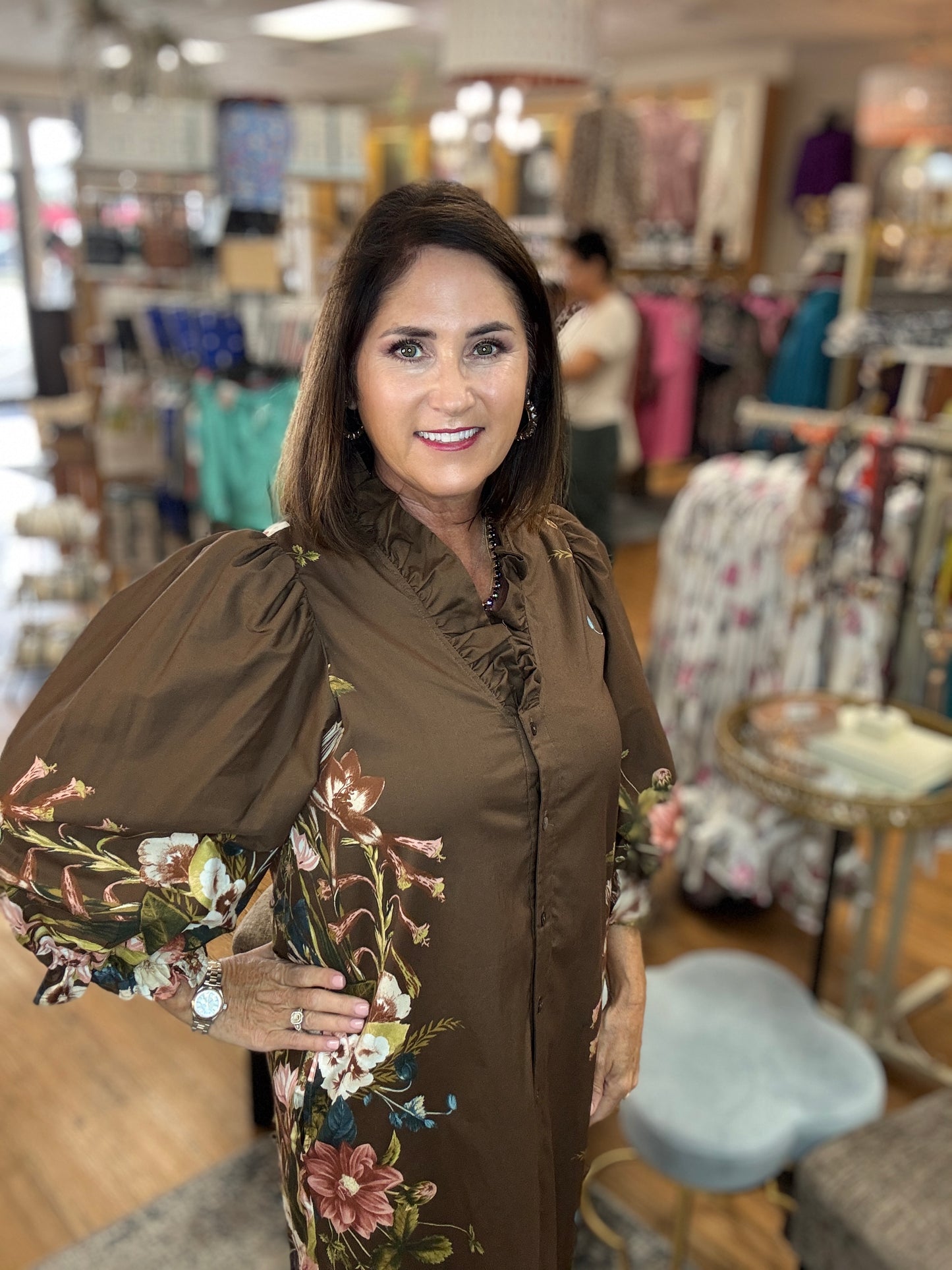 Botanical print 3/4 sleeve mini dress featuring ruffled accent V-neck.